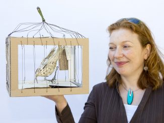 Picture of Elaine Downs with sculpture from 2013